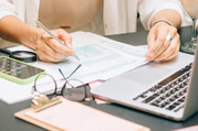 Hands doing tax paperwork