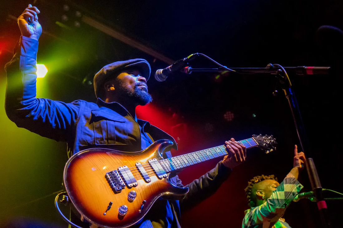 Band member of ZiMBiRA playing guitar