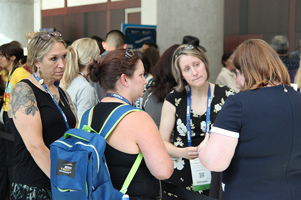 Group of attendees at an educational conference at a networking event