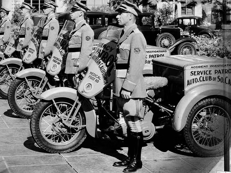aaa service patrol men in the 1900s lined up side by side