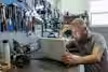 a man sitting at a table with a laptop