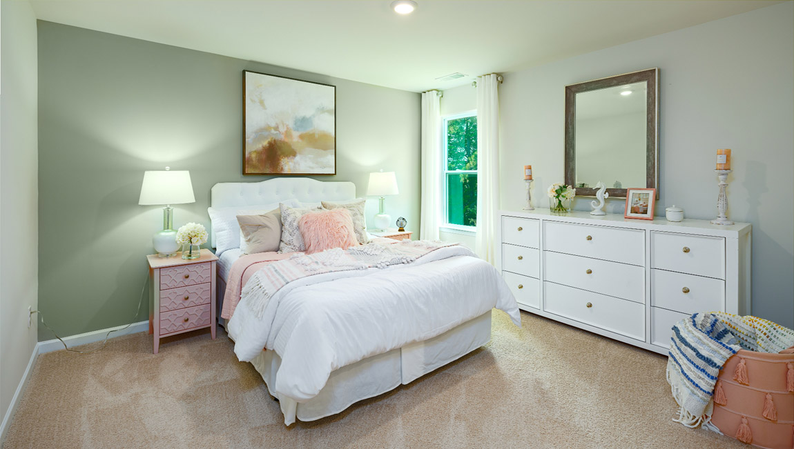 Carpeted bedroom with small window