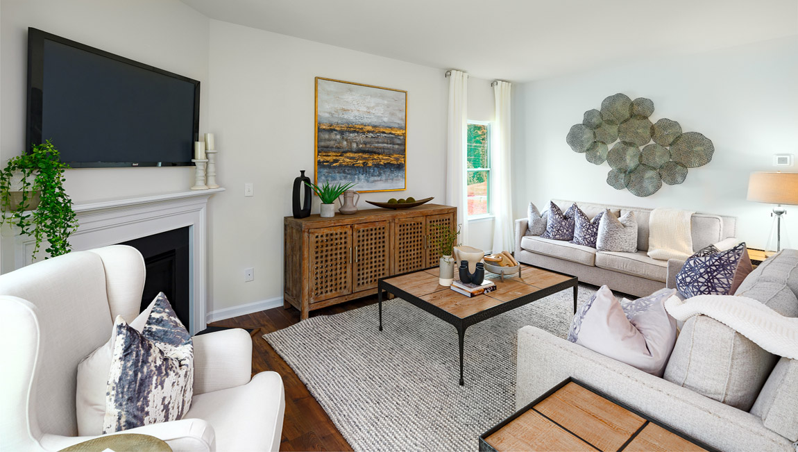 Open family room with fireplace and windows on either side