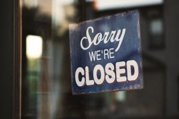 Photo of a sign reading "sorry, we