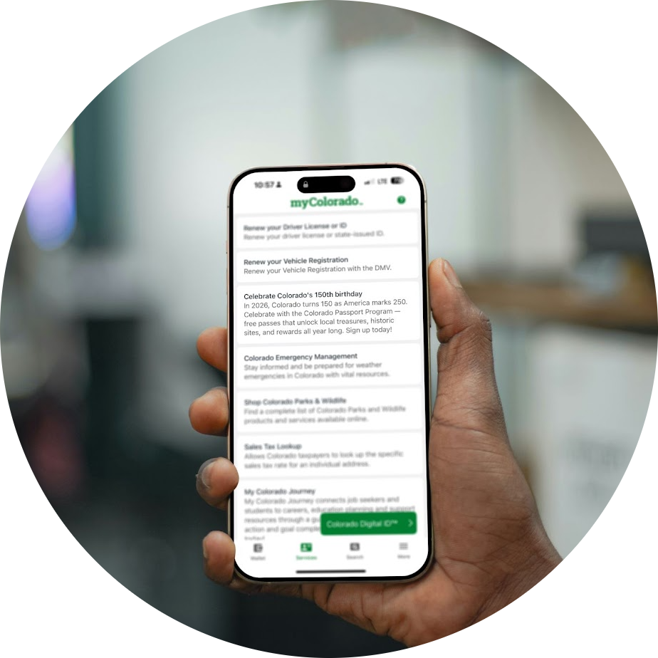 Hand holding Colorado Passport Program on their phone