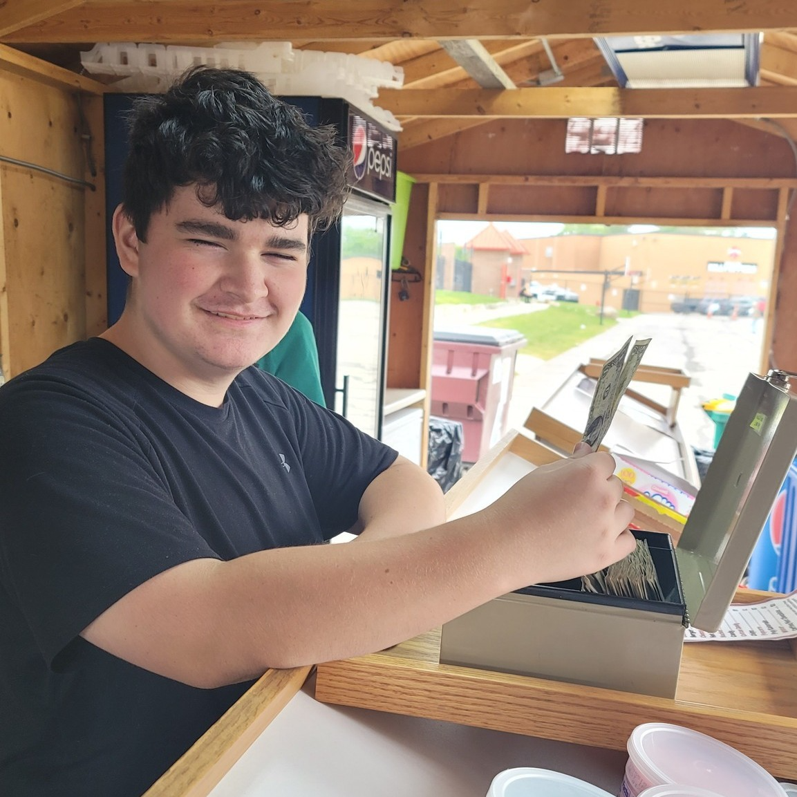 A student working at a concession stand.