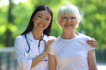 A senior and a doctor outside 