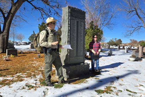 City Ranger naturalist and Museum staff member by the WWI memorial in Louisville cemetery