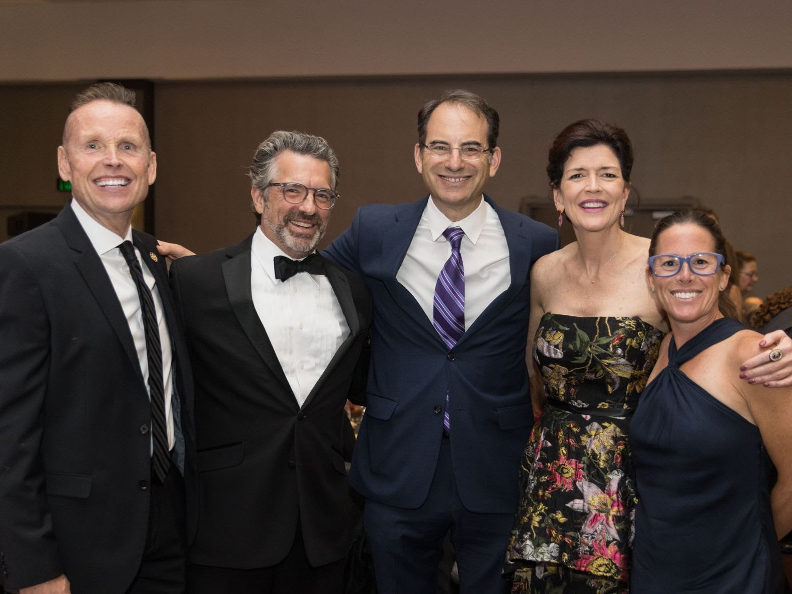 a group of people posing for a picture at a party