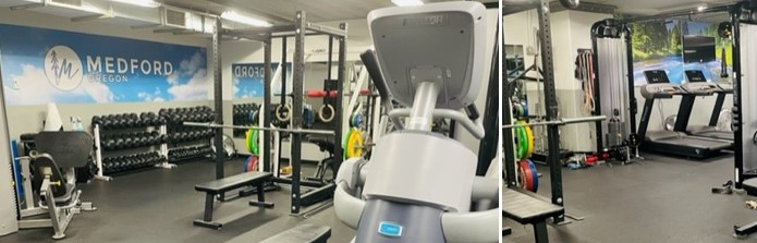 A well-equipped gym featuring weightlifting benches, dumbbells, cardio machines, and a motivational wall mural.