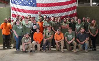 A group of people posing for a photo

AI-generated content may be incorrect.