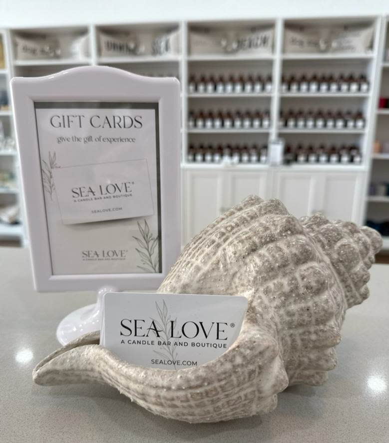 A sea shell with a card in it

AI-generated content may be incorrect.