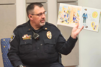 police officer reading picture book