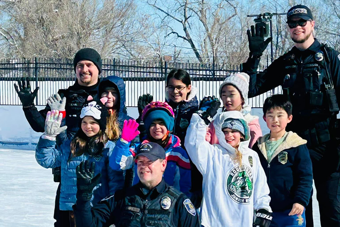 Children with Louisville police officers at Skate with a Cop event
