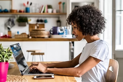 Woman working on computer at home