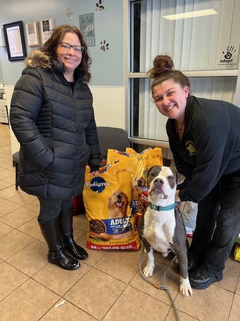 Two women standing next to a dog

AI-generated content may be incorrect.