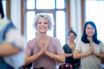 older adult woman meditating