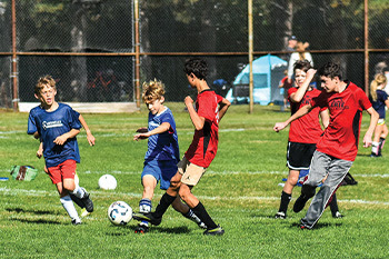 kids playing outdoor soccer 