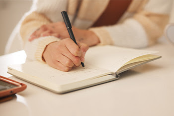 Image of someone writing