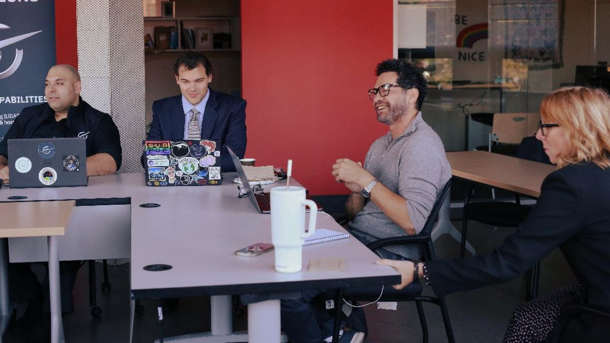 TVX students sitting around a table during class