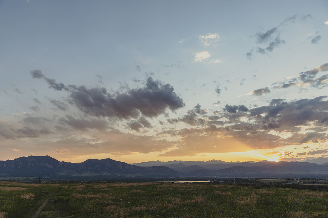 View of Louisville and the mountains from Aquarius Open Space near sunset