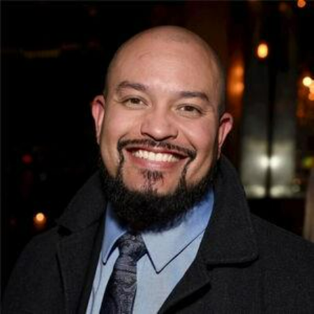 A person with a beard smiling 
AI-generated content may be incorrect.