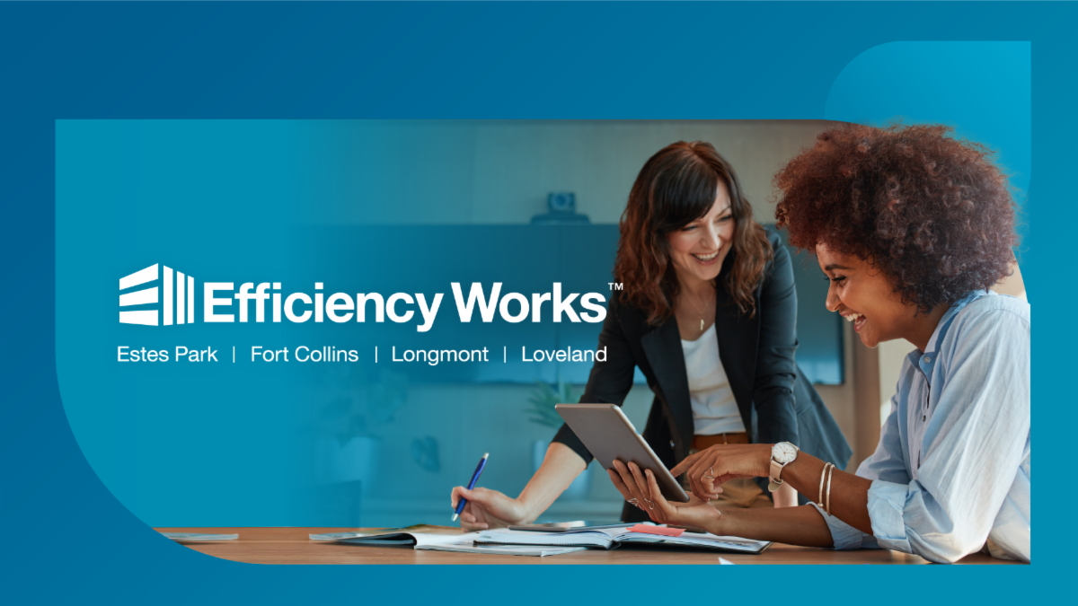Two women are looking at a tablet computer and working together. The Efficiency Works logo is also shown.