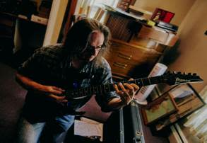 A person playing a guitar