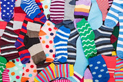 Many differently colored and patterned socks