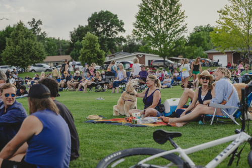 People gathered on lawn for live music