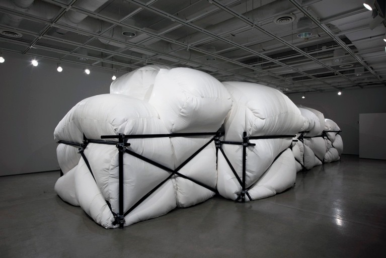 A group of white bags in a warehouse AI-generated content may be incorrect.