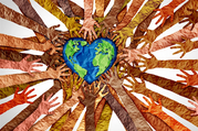 Paper craft arms surrounding a paper craft heart-shaped Earth