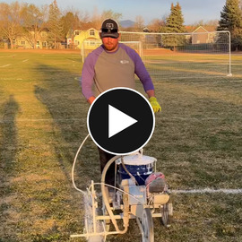 Guy line painting soccer field 