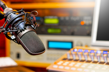 Radio microphone with radio equipment in the background