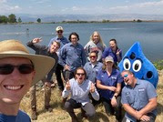 water treatment plant team posing with drippy, their water mascot