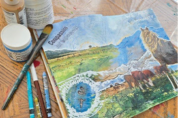 painting  of a horse and paint supplies 