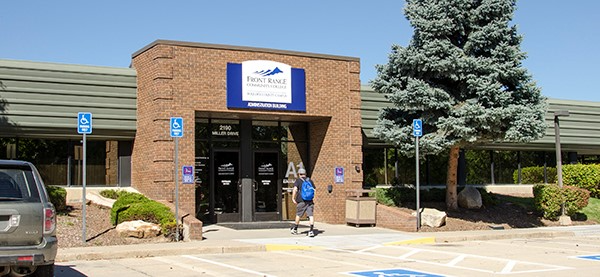 A brick building with a sign reading 