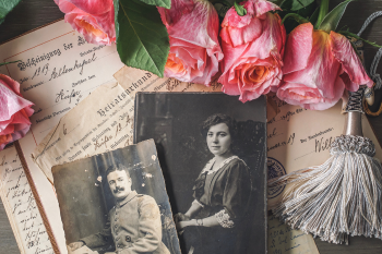 Collage of historic photos and documents, and flowers