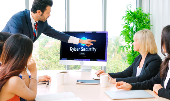Work team in meeting room getting cybersecurity training.