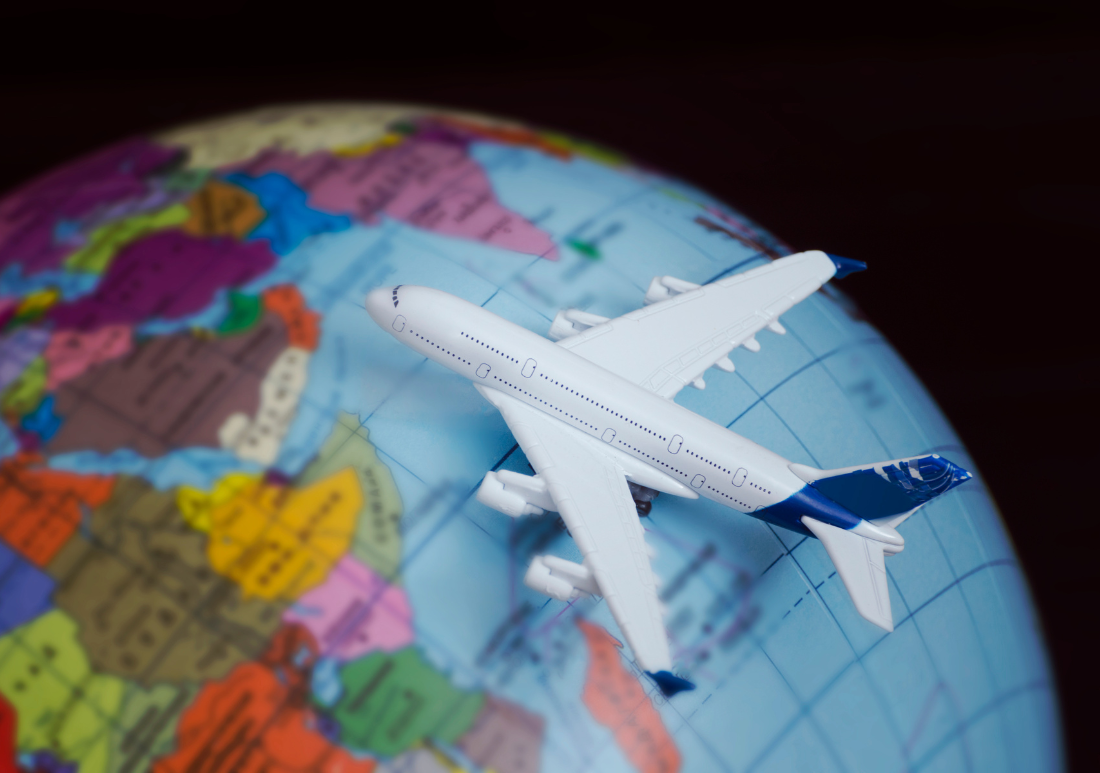 globe with toy airplane 