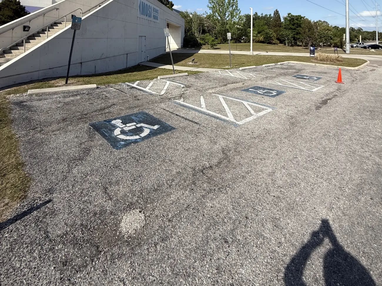 MOSI parking lot ADA accessible spaces worn and faded before Radiant Striping repainted them, Museum of Science and Industry Tampa