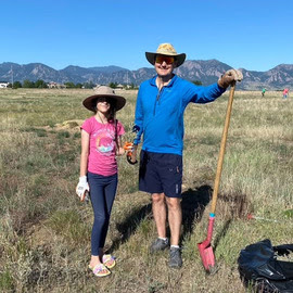 Adad and his daughter digging up weeds