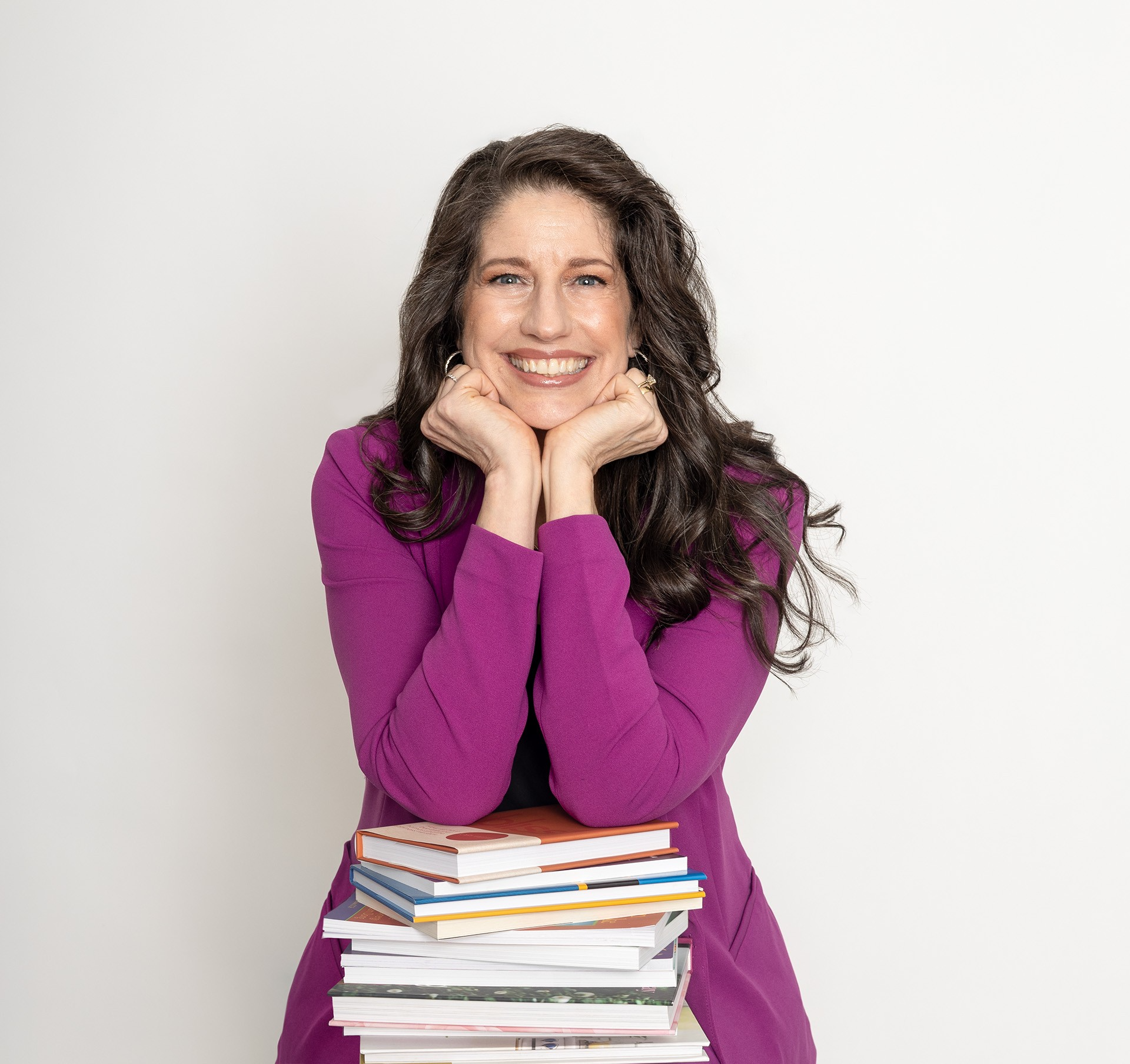 Fabi Preslar-Headshot-Stool-BooksCROP-9.jpg