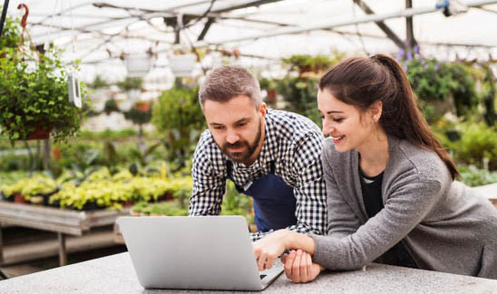 Business owners working together on their laptop.