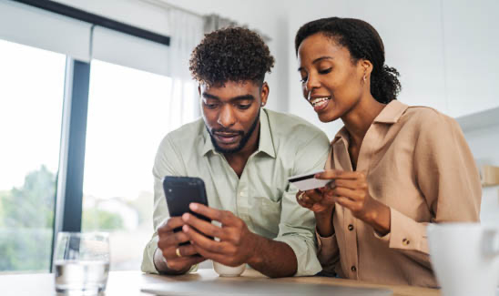 Small business owners looking at a report together.