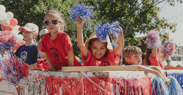 Kids watching Labor Day Parade go by