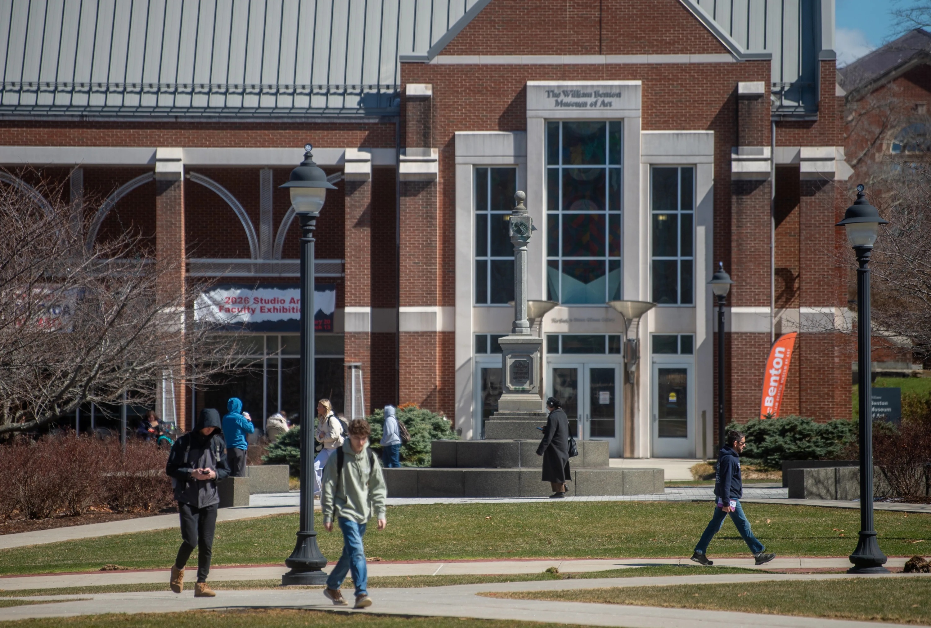 UConn students pass the William Benton Museum of Art on UConn’s main campus in Storrs on Tuesday, March 24, 2026. (Aaron Flaum/Hartford Courant)