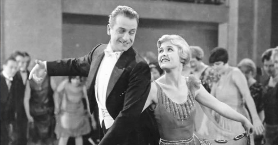 Black and white image of gentleman and lady dancing