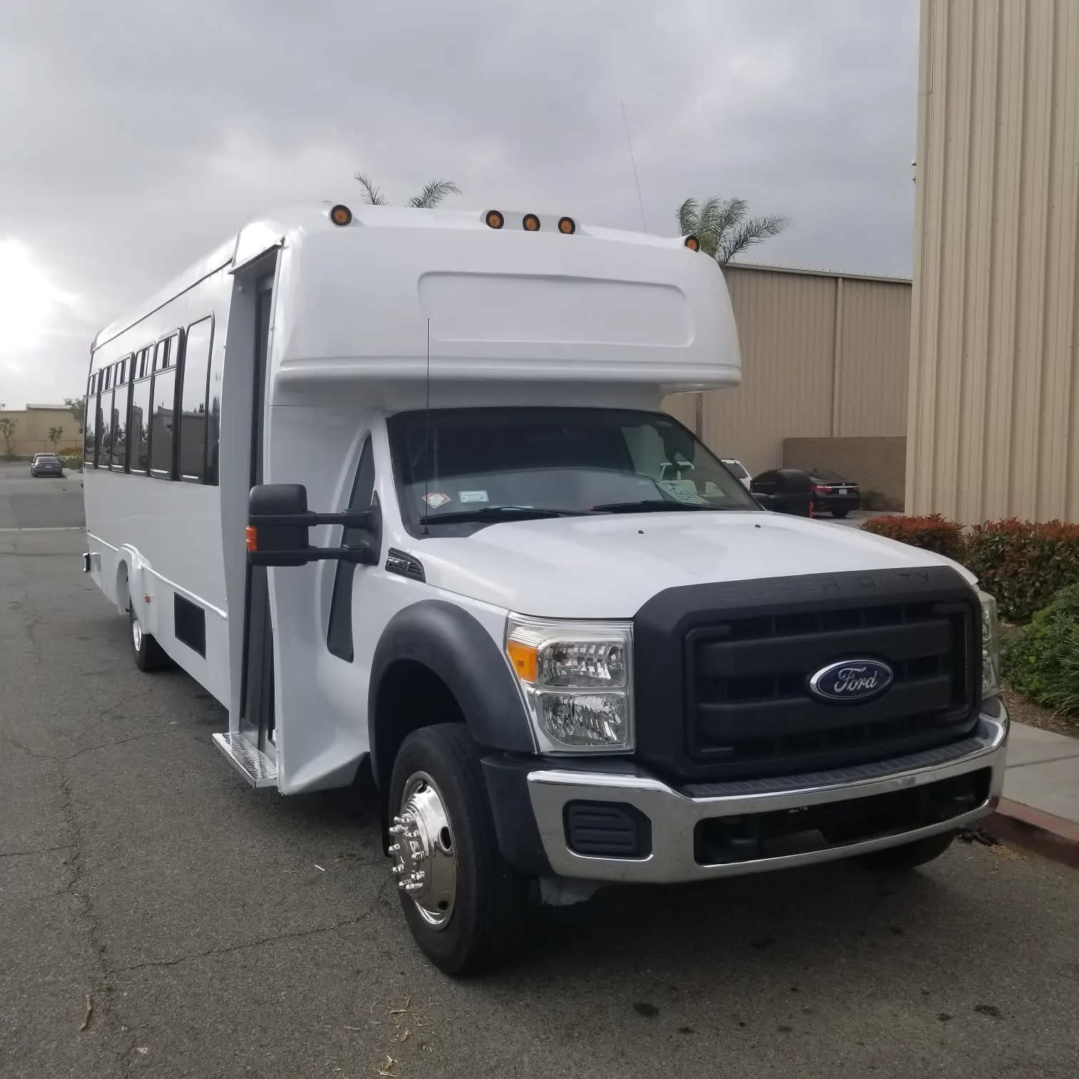 White 30-passenger party bus exterior