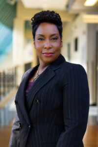 Headshot of Dr. Simpson in a black blazer